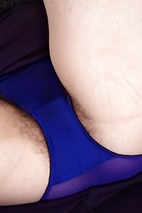 Milana shows her saucy nipples and thin pussy as she reveals her blue panties