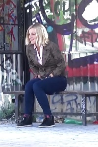 Blonde has fun as she pissing while standing