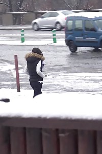 Take a look at the snow melt as this black-haired hottie pees