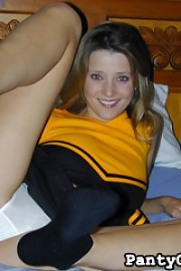 She is clothing a lovely yellow and blue cheerful outfit, complete with the tiny miniskirt that cheerleader are known for.