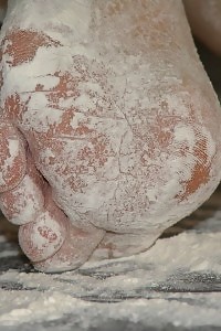Kirsty Blue cares her delightful legs in flour and does a foot fetish
