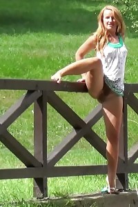 Magnificent ginger lifts up her leg to piss outside