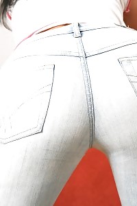 Take a look at this flirtatious dark-haired jeans covered booty
