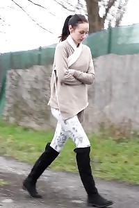 Black haired hottie relieves herself in public