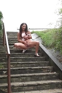 Black-haired pissing in public over concrete steps