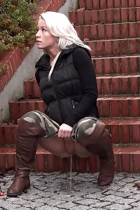 Captivating light-haired pisses on the ground outside