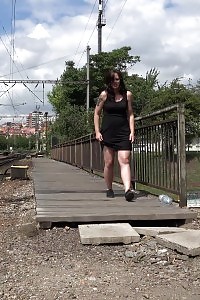 Black haired European peeing outside in public