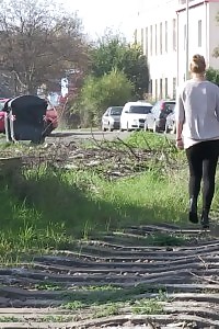 Magnificent blonde in specs pisses next to railway