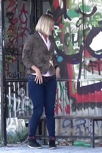 Blonde has fun as she pissing while standing