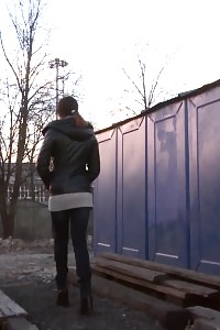 Slender European honey pisses in the middle of city