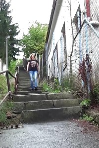 Blonde honey pissing on the bottom of some steps