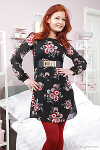 Brown eyed Freya H is well-toned wearing her floral minidress and ankle boots.