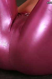 Alisa magnificently poses on the ball in her pink latex pants  and bra