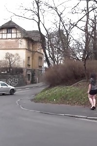 Black haired chick pulls her thongs while peeing