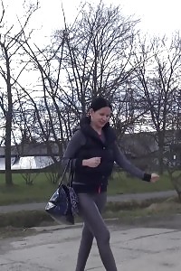 Brunette doll is desperate to piss when walking