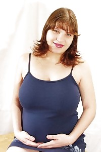 Awesome pregnant having fun with her eating tits and good rounded stomach before stretching her gap