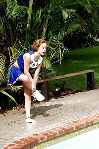 This filthy cheerleader gets dirty and dives in a swimming pool nude and starts touching her cunt in this pics