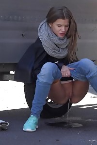 Outstanding European squats by a trailer to pee