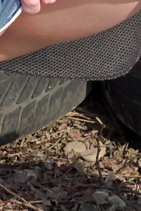 Black haired cutie squats to piss in the snow