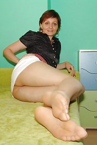 Kirsty Blue demonstrates her mouth-watering pussy inside her pantyhose