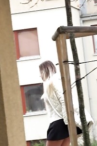 Incredible model in glasses pisses in a car park space