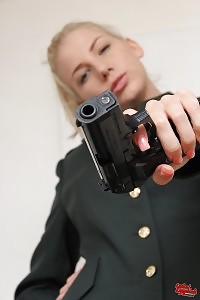 Danielle May having fun with her gun