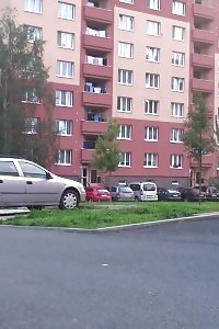 Filthy brunette pisses in the mid of a car park