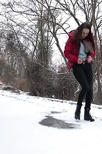 Cynthia Vellons melts the snow as she pissing outside