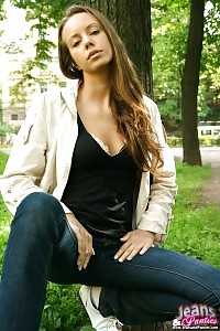 All beautiful charm takes off her tight denim jeans outdoor