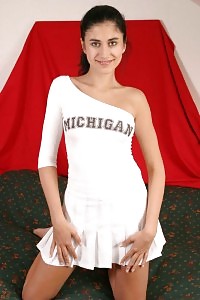 Smoldering hot cheerleader demonstrates against the camera and jerking her trimmed labia