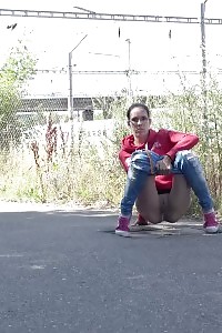 European in glasses squats to pee by railway
