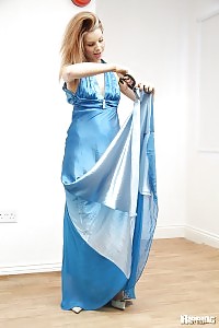 Blonde looks so cute as she ripping her dress with scissor