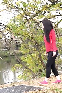 Black haired European pisses outside by watershed