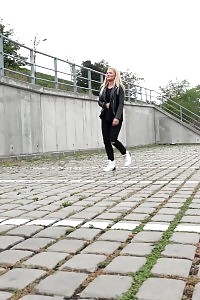 Appealing blonde squats outside to piss in the city