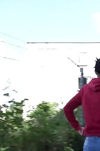 European in glasses squats to pee by railway