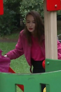 Black-haired pornstar shows her bearded pussy while peeing