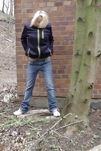 Blonde doll pisses in public as cars drive past