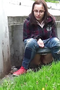 Innocent Librarian pisses onto the ground outside