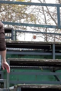 Naughty black-haired sprays her pee outside
