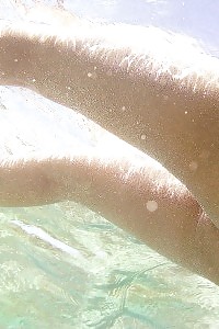 Oversexed Asian queen floats in the water nude having her birthday