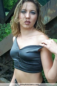 Lucille strips outdoors undressing her sexy outfit