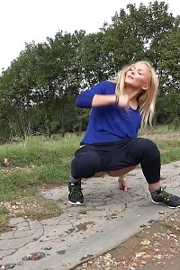 Fascinating blonde in blue pisses outdoors