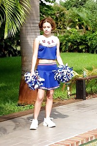 This filthy cheerleader gets dirty and dives in a swimming pool nude and starts touching her cunt in this pics