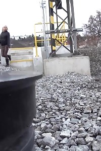 Seductive blonde pisses right next to a railway line