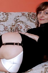 Kirsty exhibits her excellent booty in black stocking and amazing panties