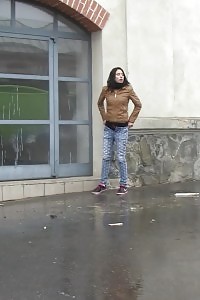 Lovely brunette girl pees in public