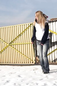 Violette squats in the snow to piss outdoors