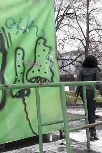 Good-looking black haired babe melts snow as she pissing