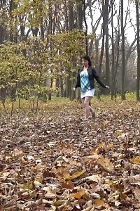 Black-haired angel pissing in the park