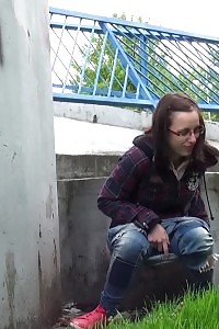 Innocent Librarian pisses onto the ground outside